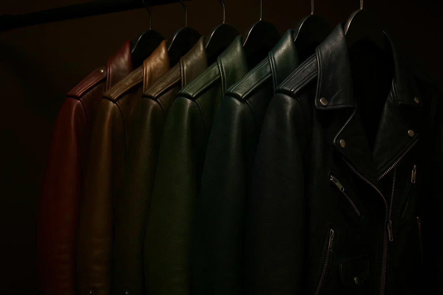biker leather jackets hanging on a rod