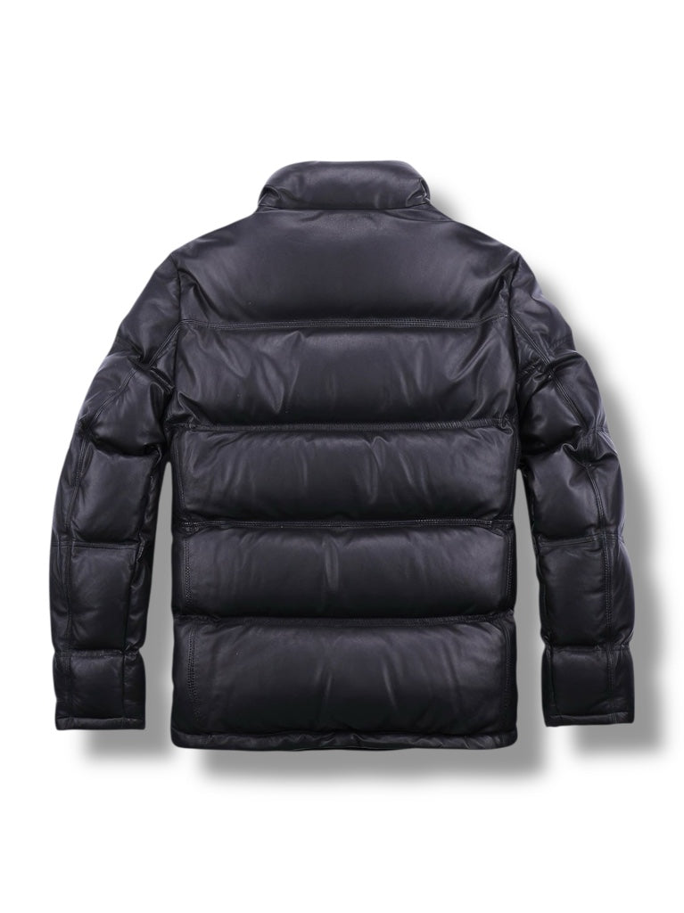 Black puffer jacket on a white background
