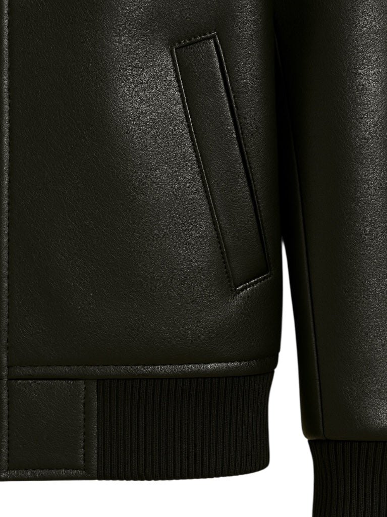 Close-up of a black leather jacket with a pocket detail on a white background
