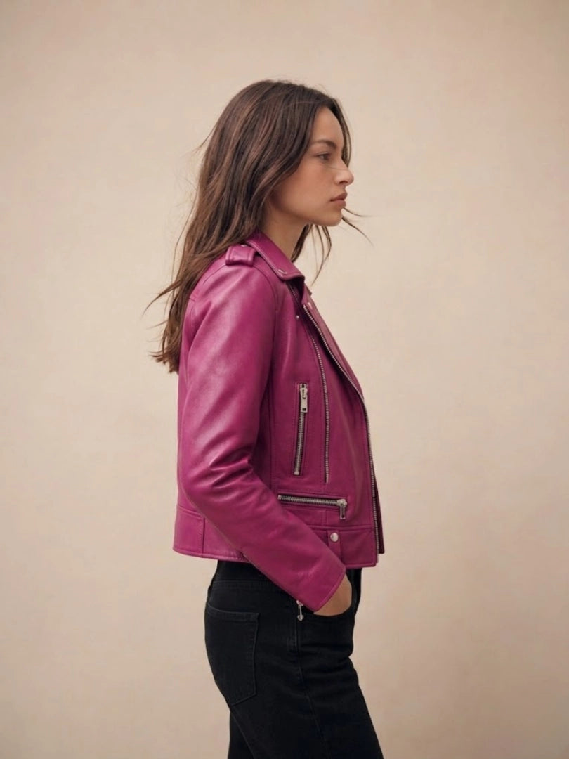 Woman wearing a pink leather jacket against a beige background