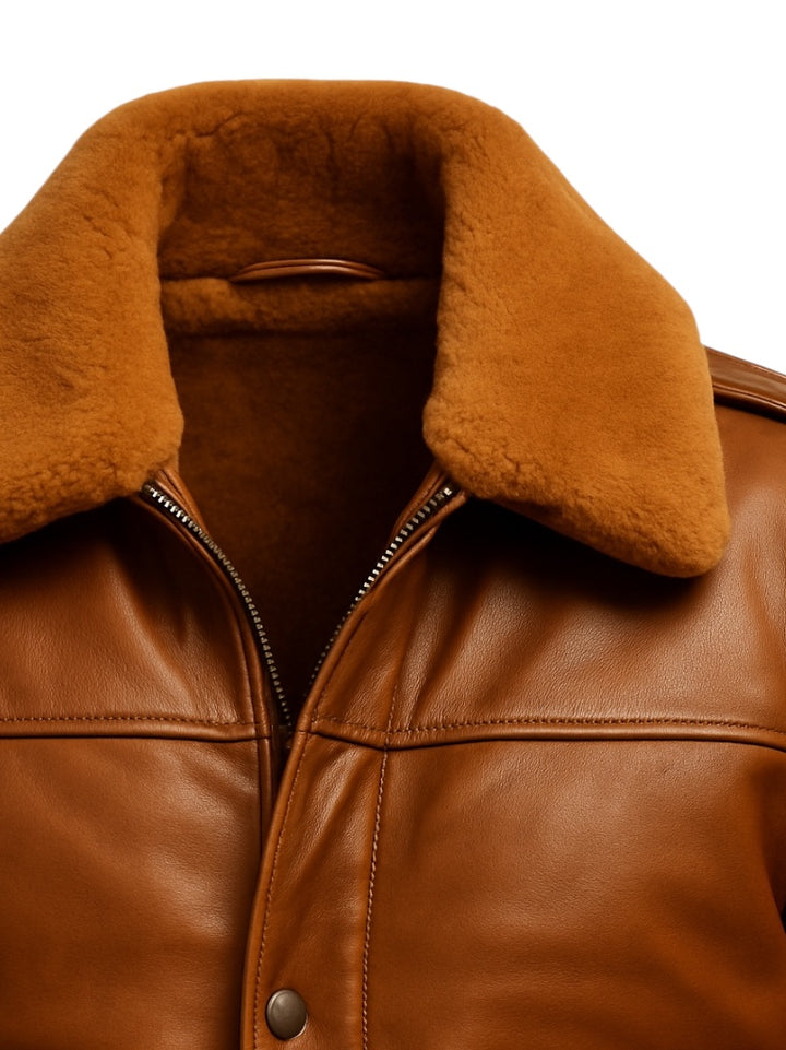 Brown leather jacket with fur collar on a white background
