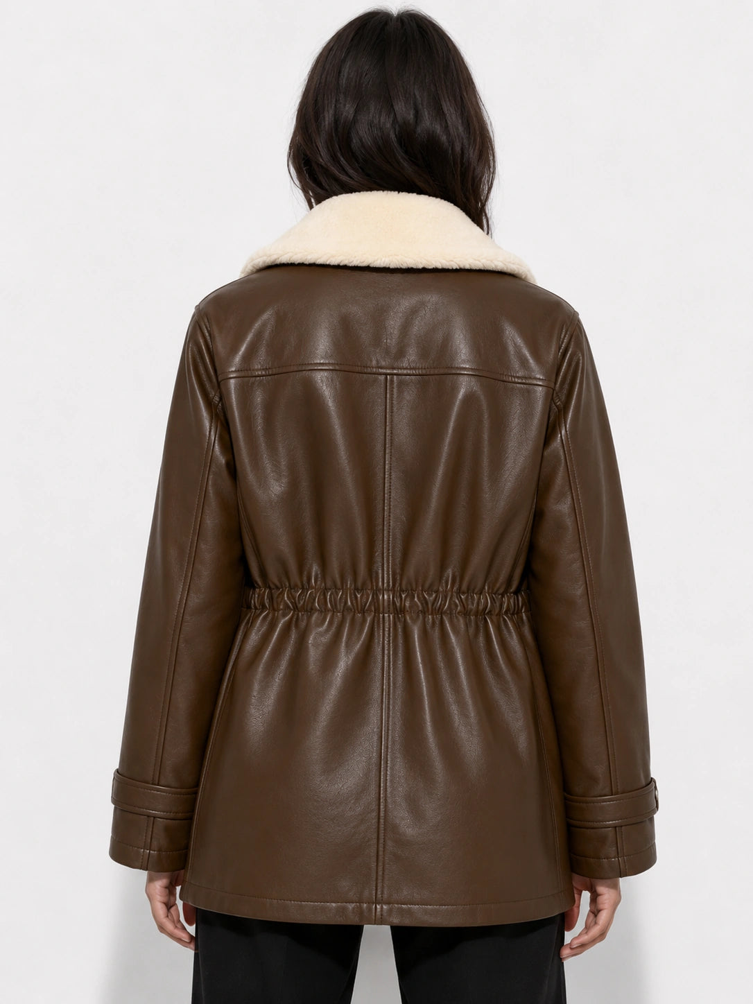 Brown leather jacket with white fur collar on a white background