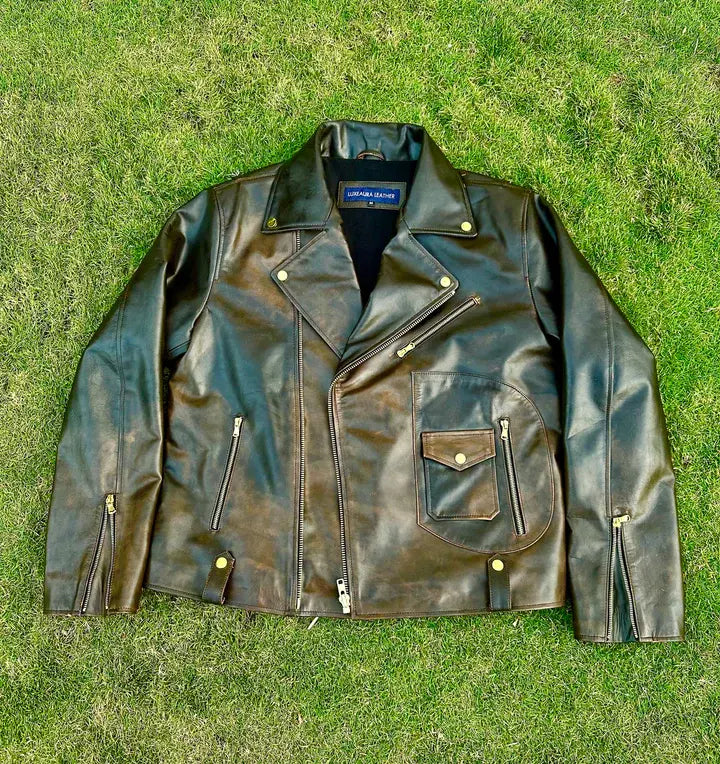 Brown leather jacket on a grassy background