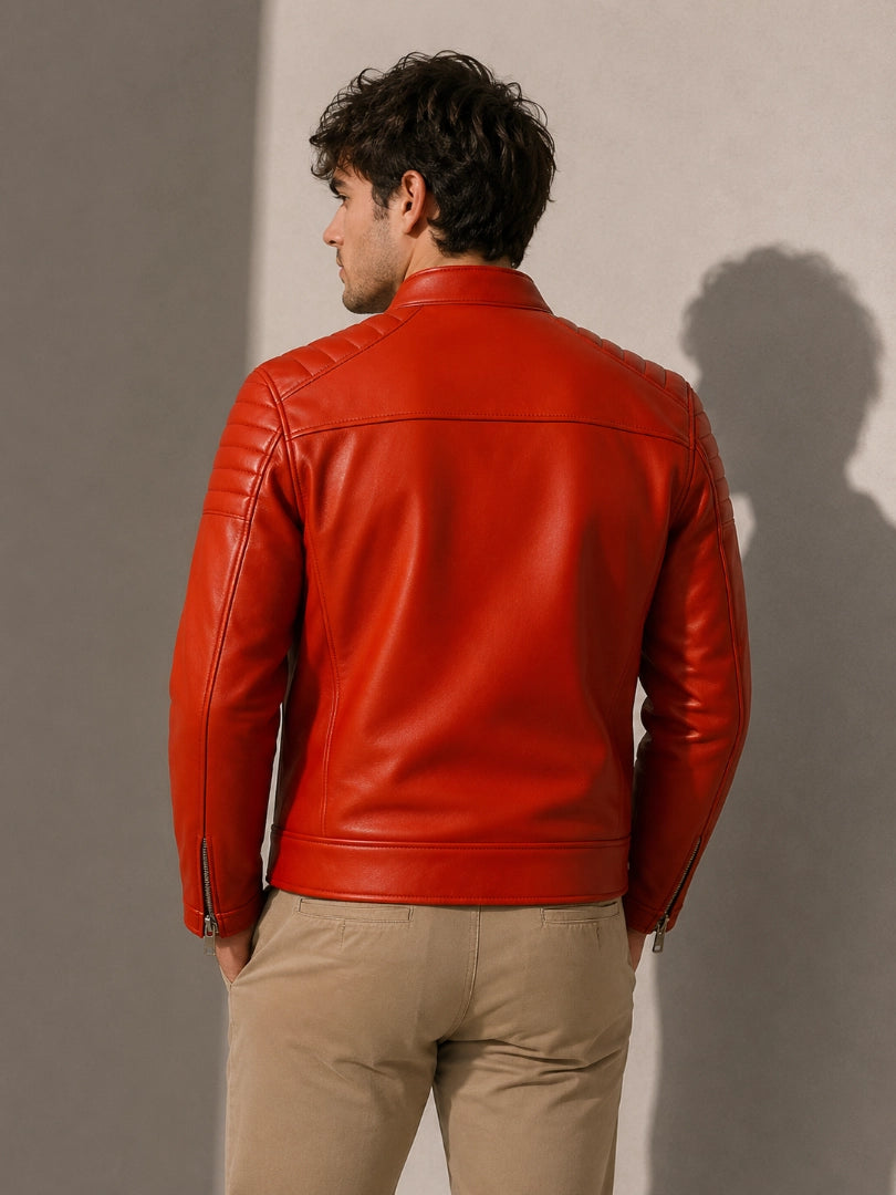 Man wearing a red leather jacket against a plain background