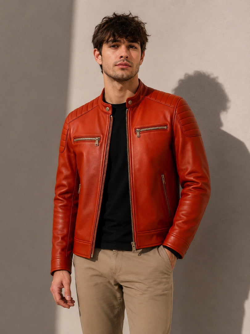 Man wearing a red leather jacket against a neutral background