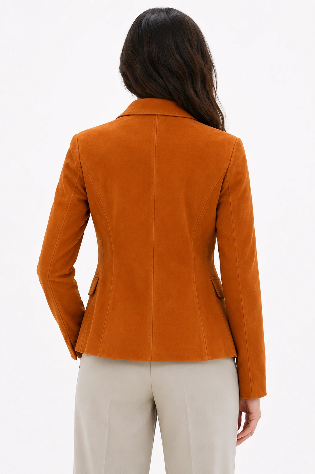 Woman wearing an orange blazer on a white background