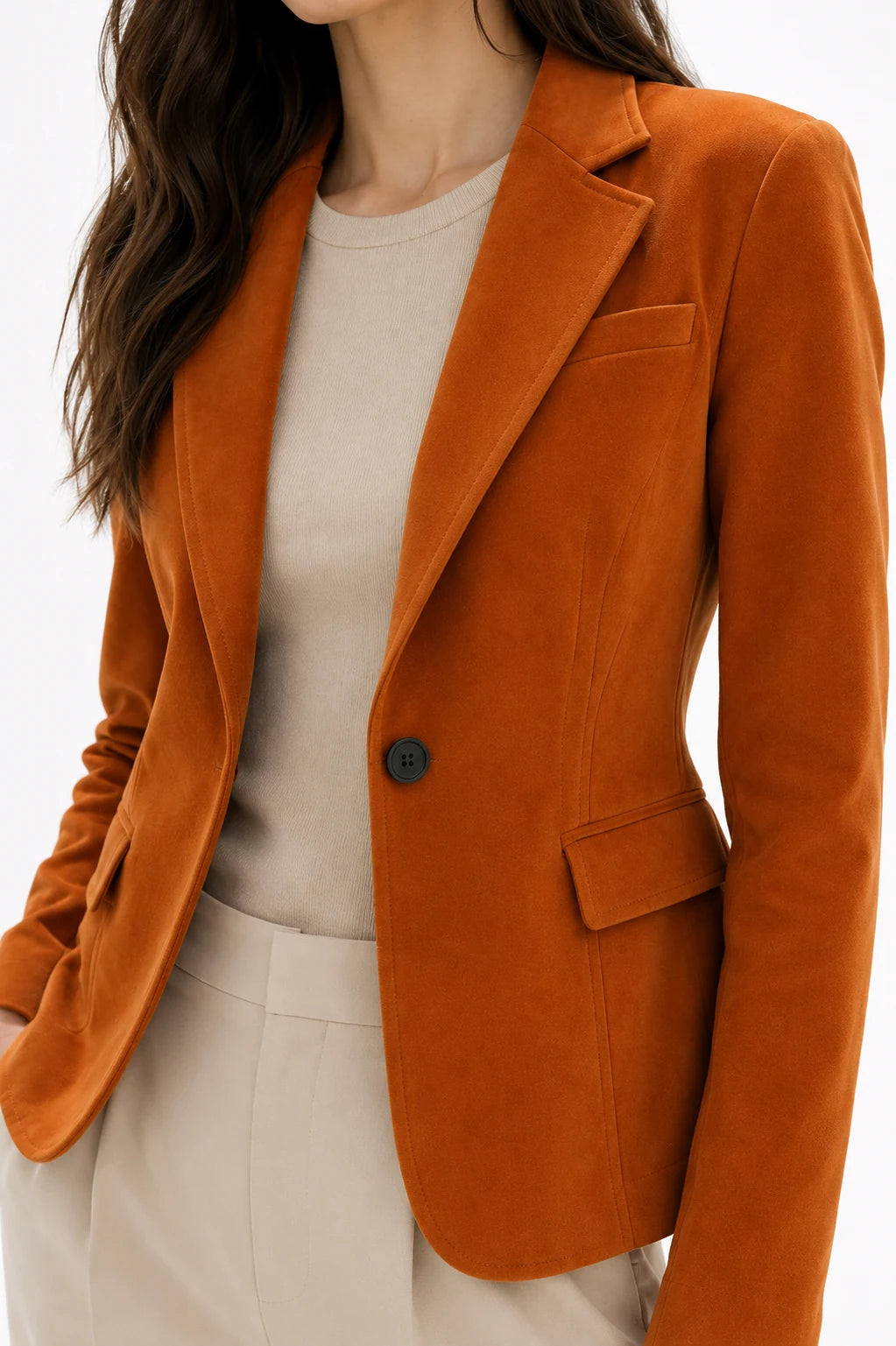 Orange blazer worn by a person on a white background