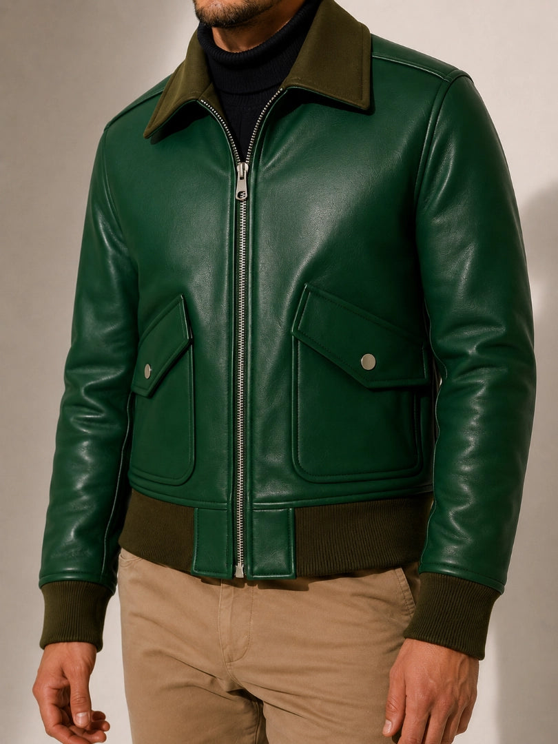 Green leather jacket with brown collar and trim on a neutral background