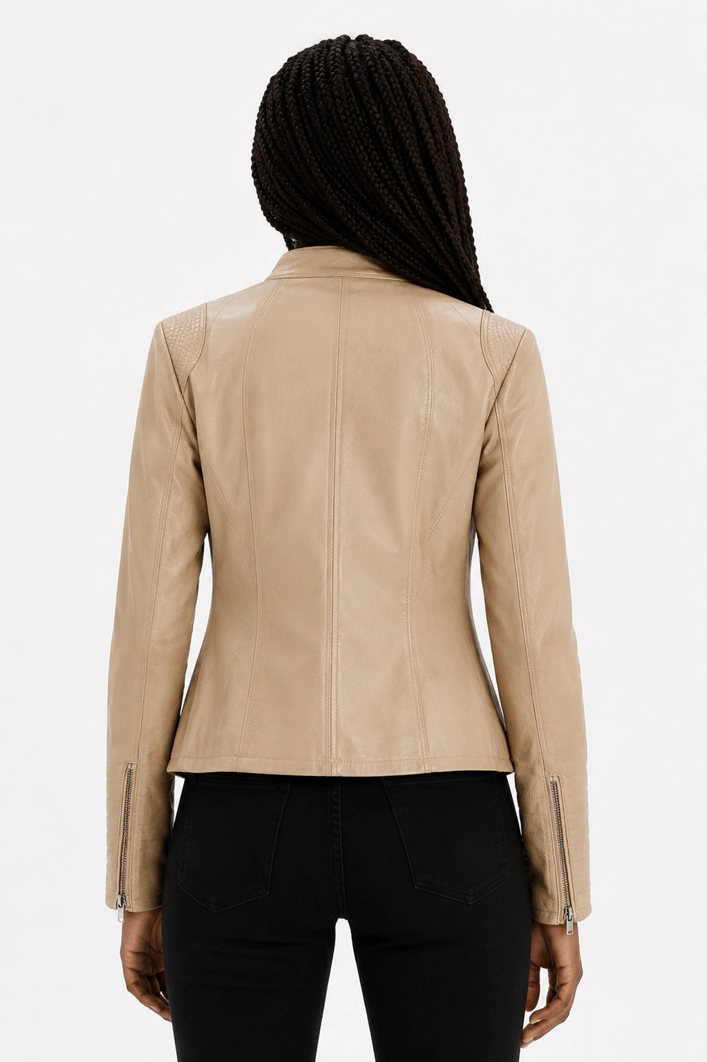 Beige leather jacket worn by a person on a white background