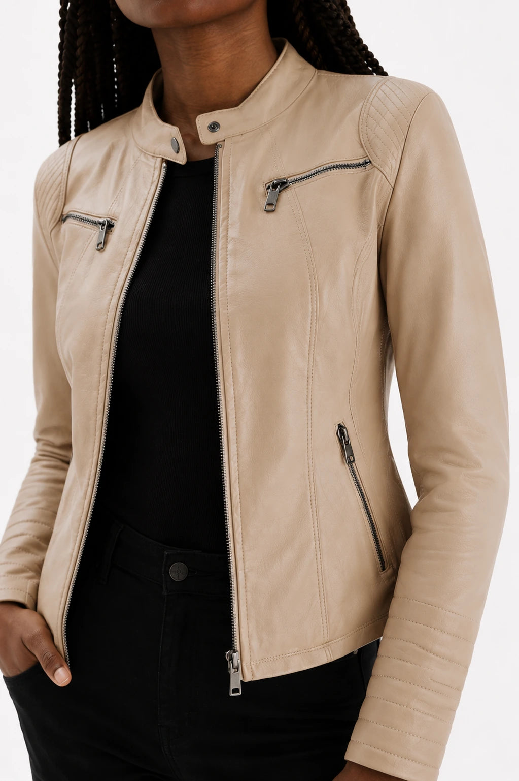 Beige leather jacket worn by a person on a white background