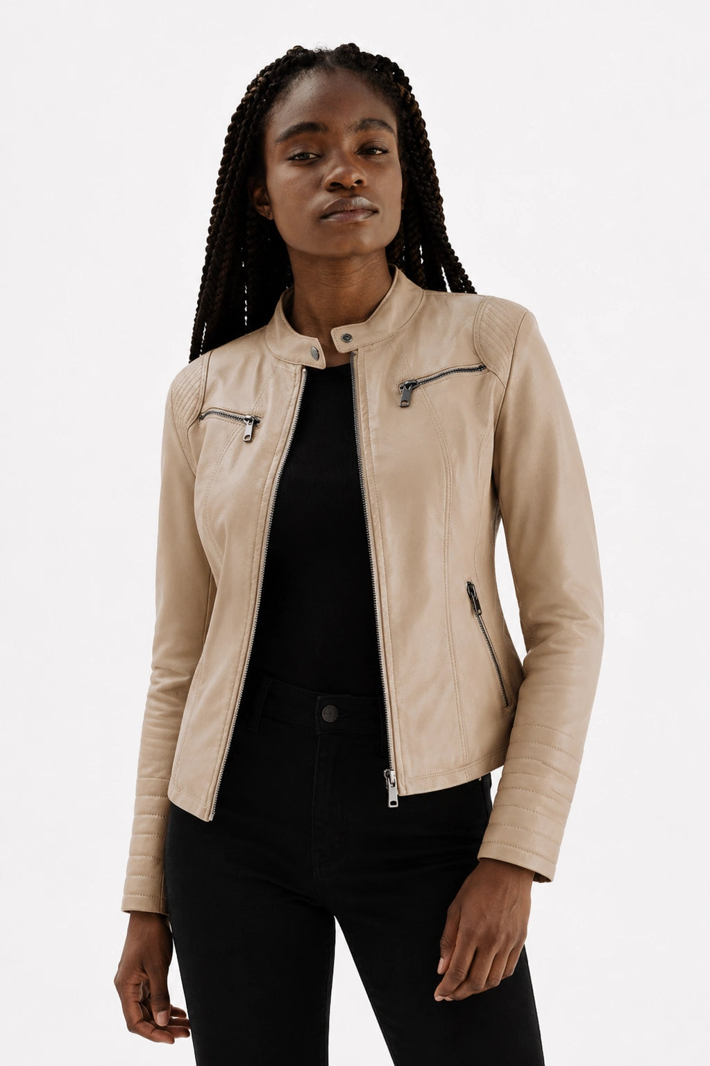 Woman wearing a beige leather jacket on a white background