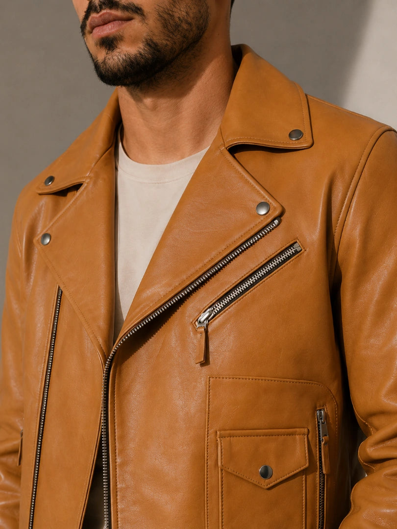 Brown leather jacket worn by a person against a neutral background