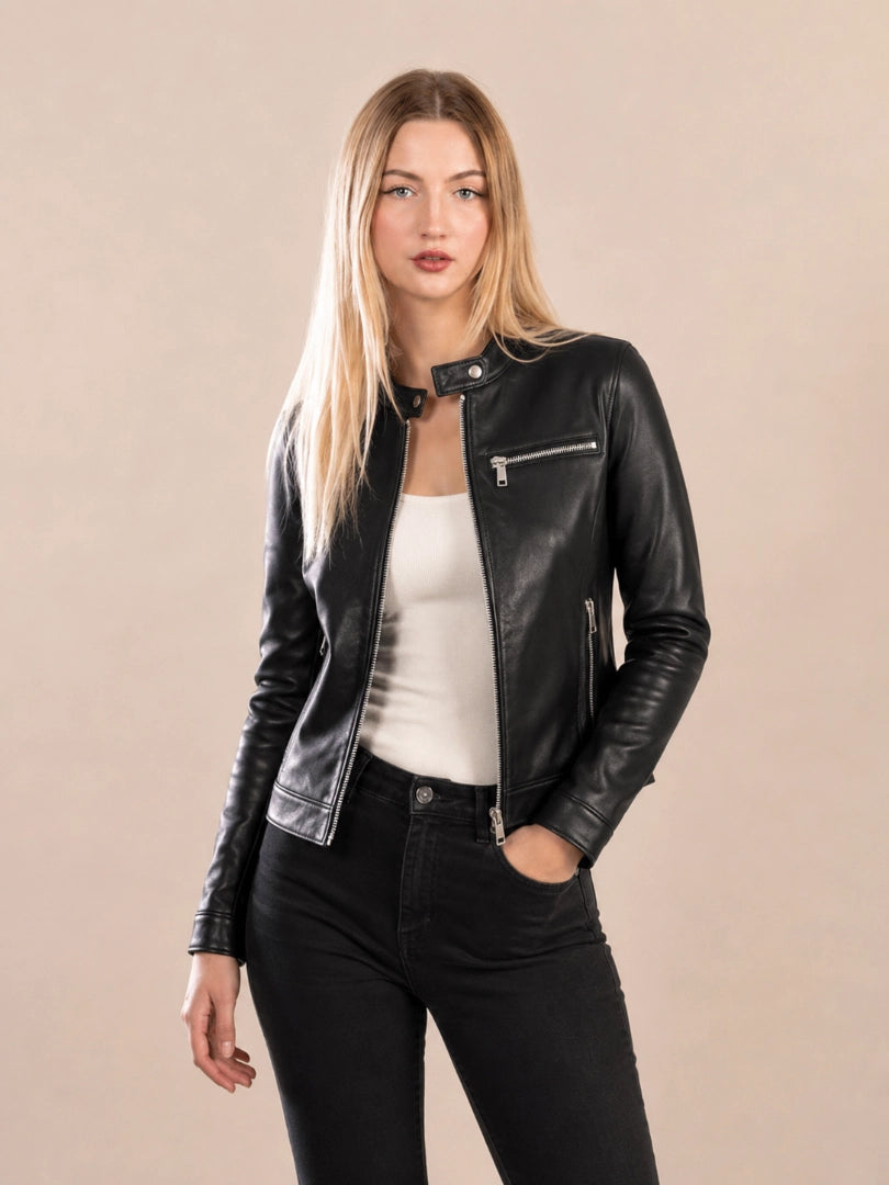 Woman wearing a black leather jacket on a beige background